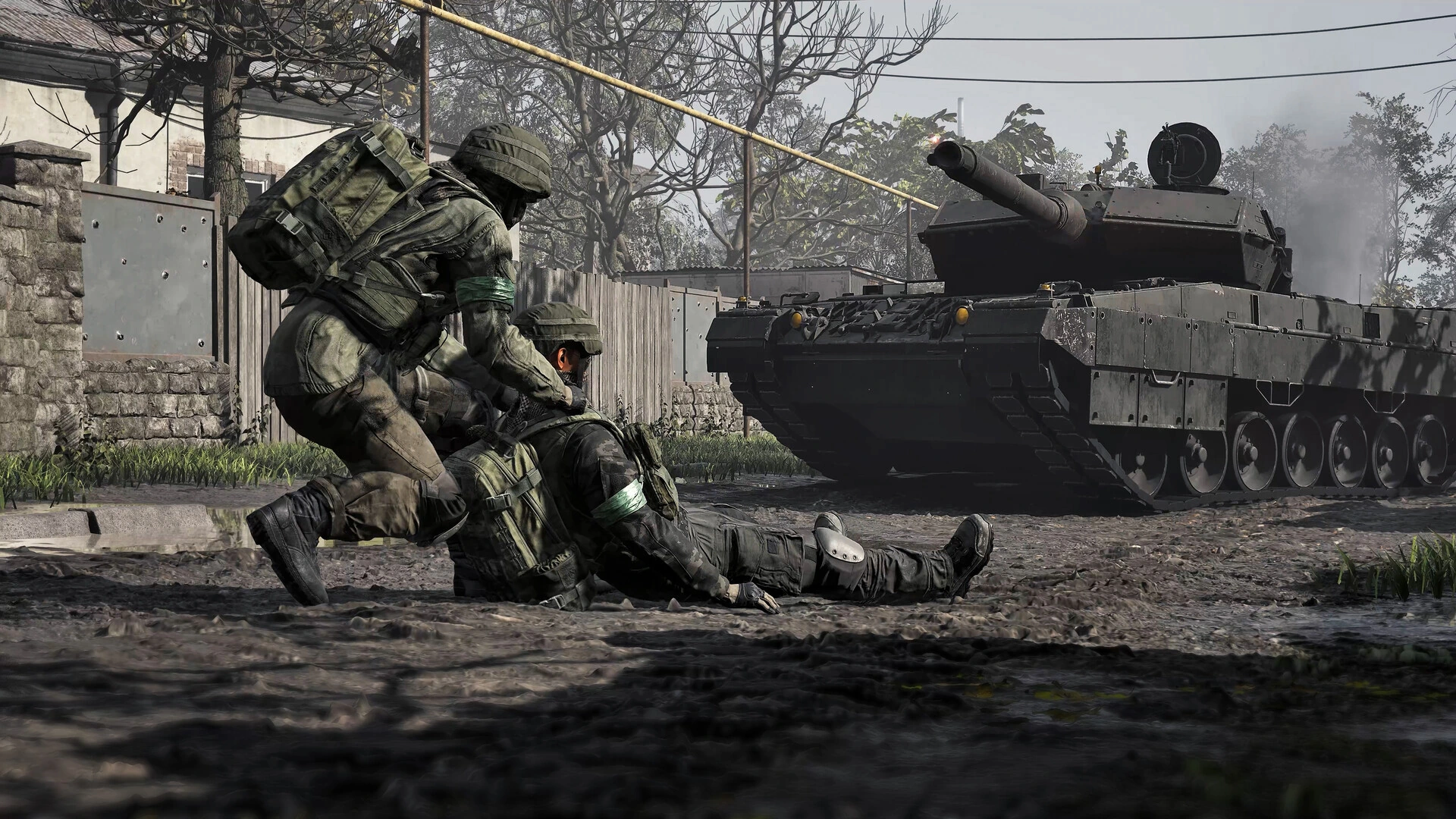 A WARDOGS soldier helping a downed teammate beside a tank